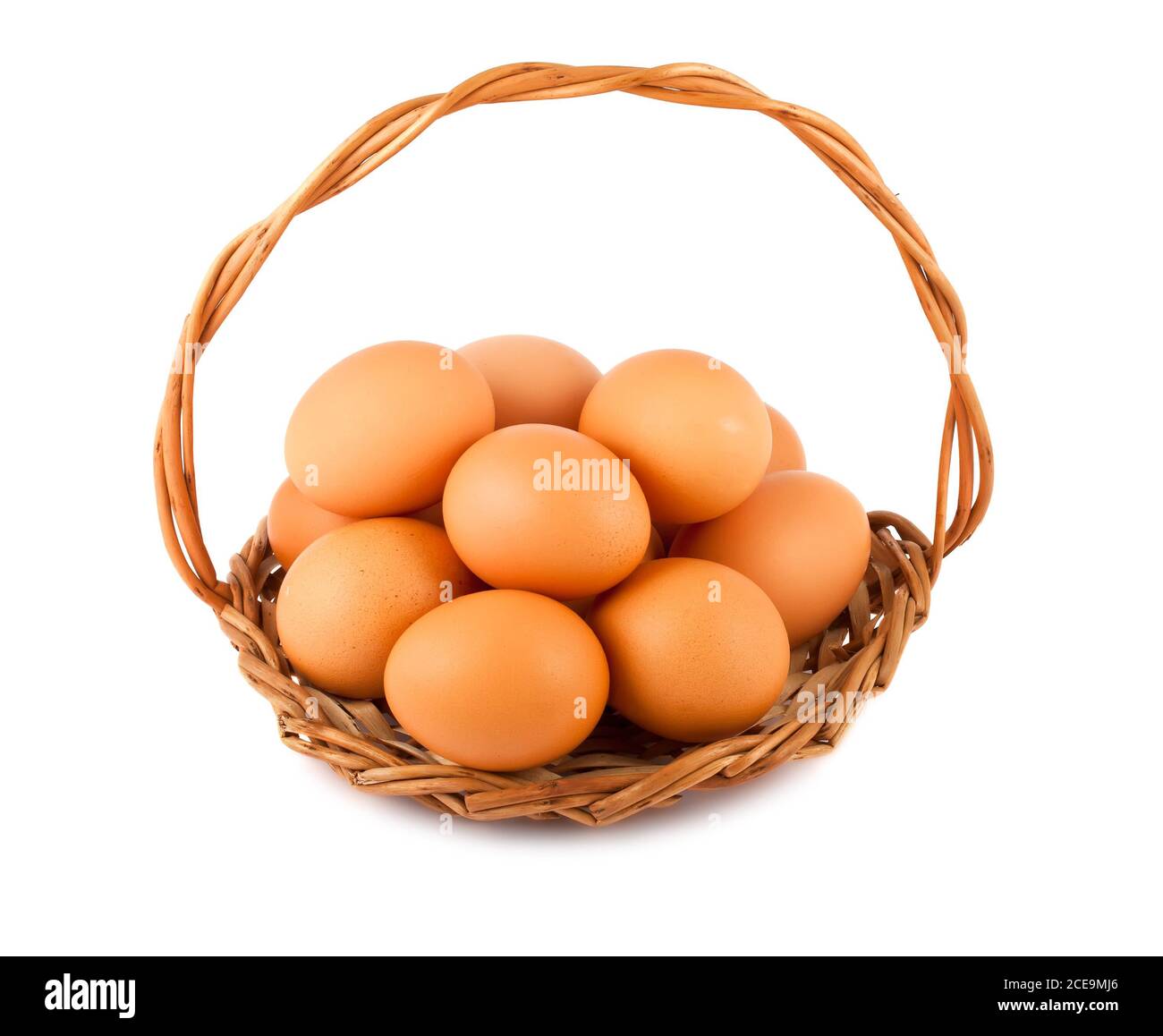 Chicken eggs on wicker basket Stock Photo