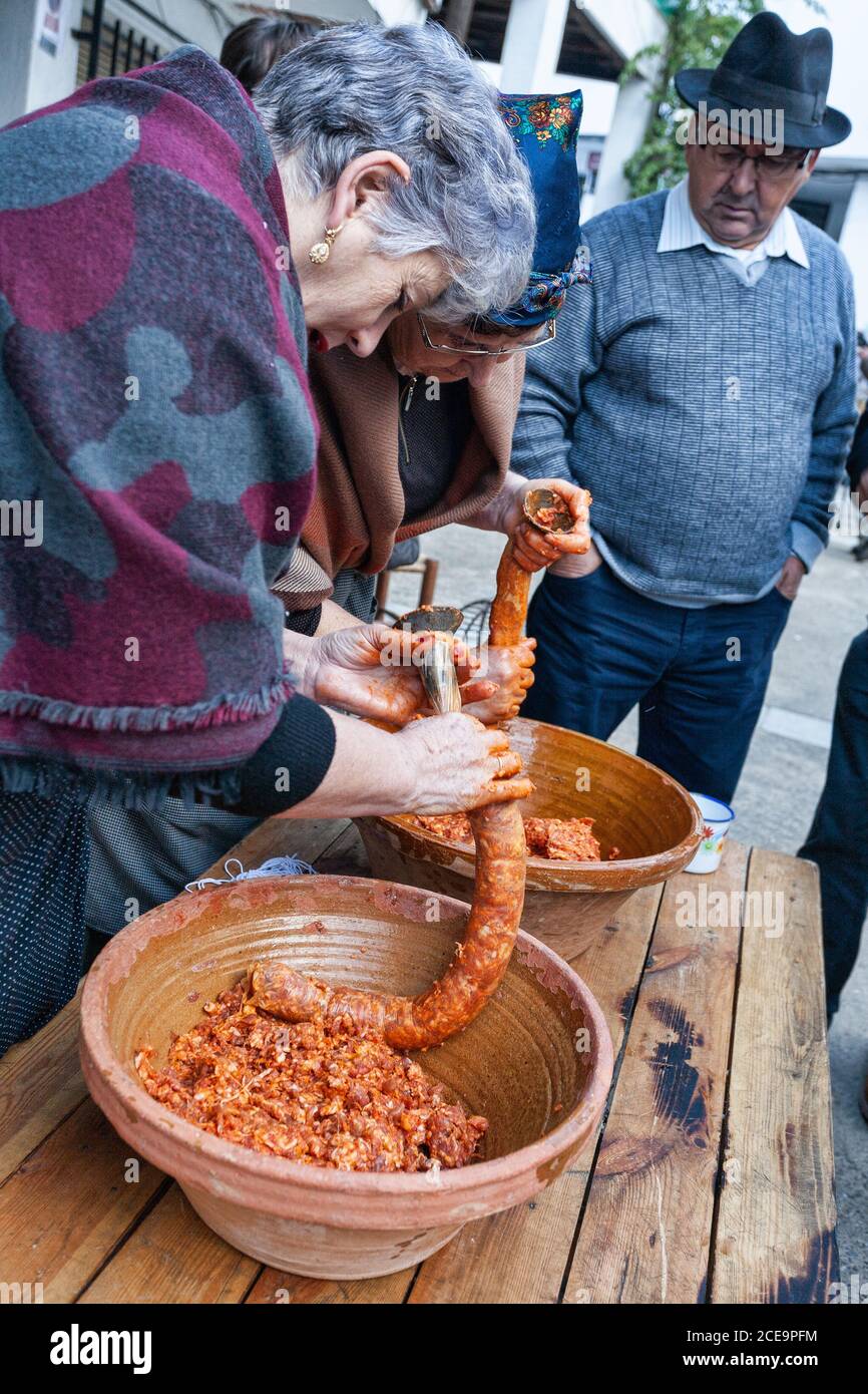 VALDASTILLAS, SPAIN - Nov 23, 2019: Feast of representation of the slaughter of the pig with traditional music, market and roast of chops on the barbe Stock Photo