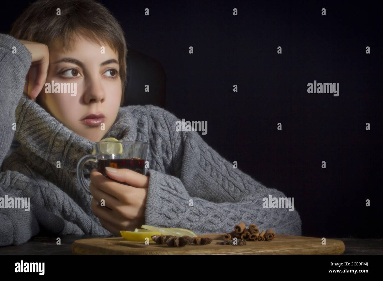 Young woman with hot drink Stock Photo