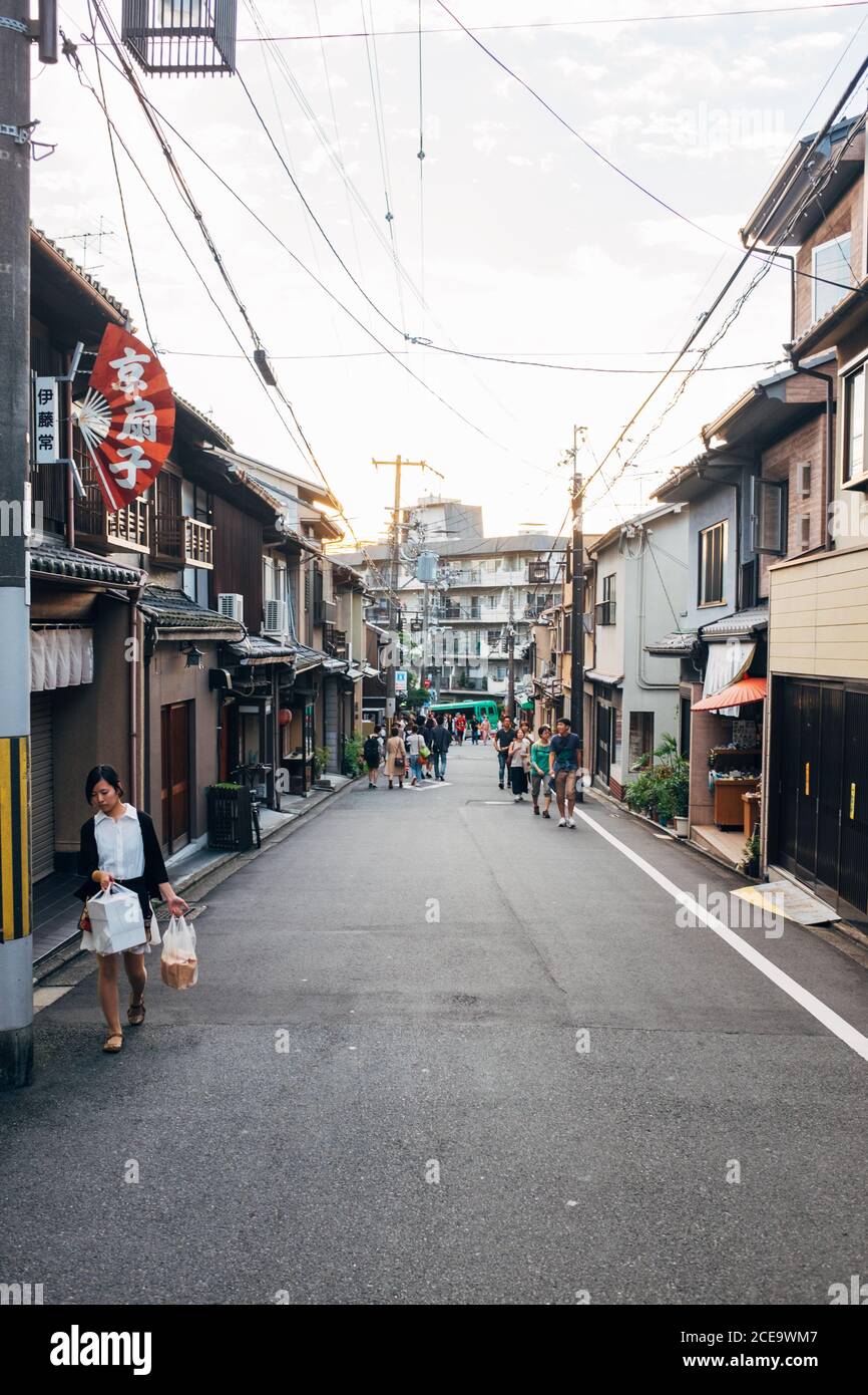 The people walking in a small street in Japan. Stock Photo