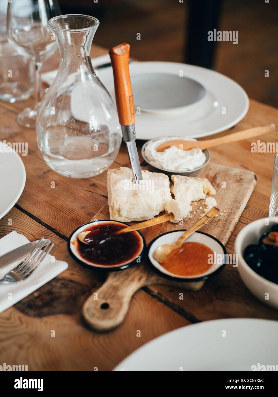 Board with cheese and sauces Stock Photo