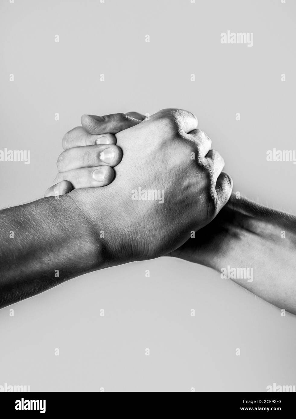 Two hands, isolated arm, helping hand of a friend. Handshake, arms. Friendly handshake, friends
