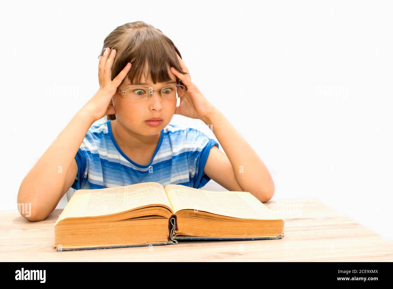 Cute teenager with books on white background Stock Photo - Alamy