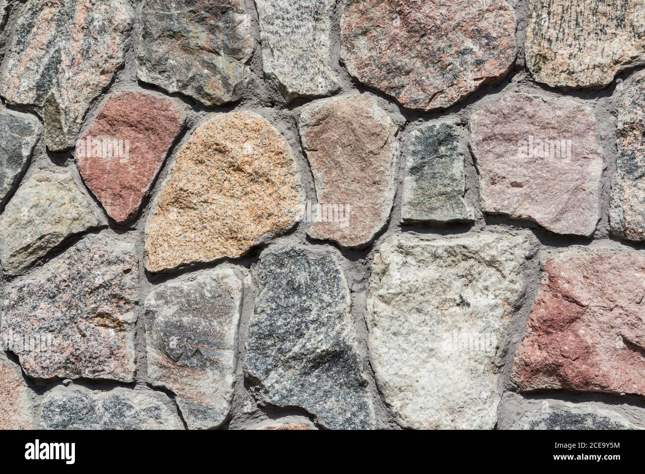 Neatly stacked rough cut stone wall texture background Stock Photo - Alamy