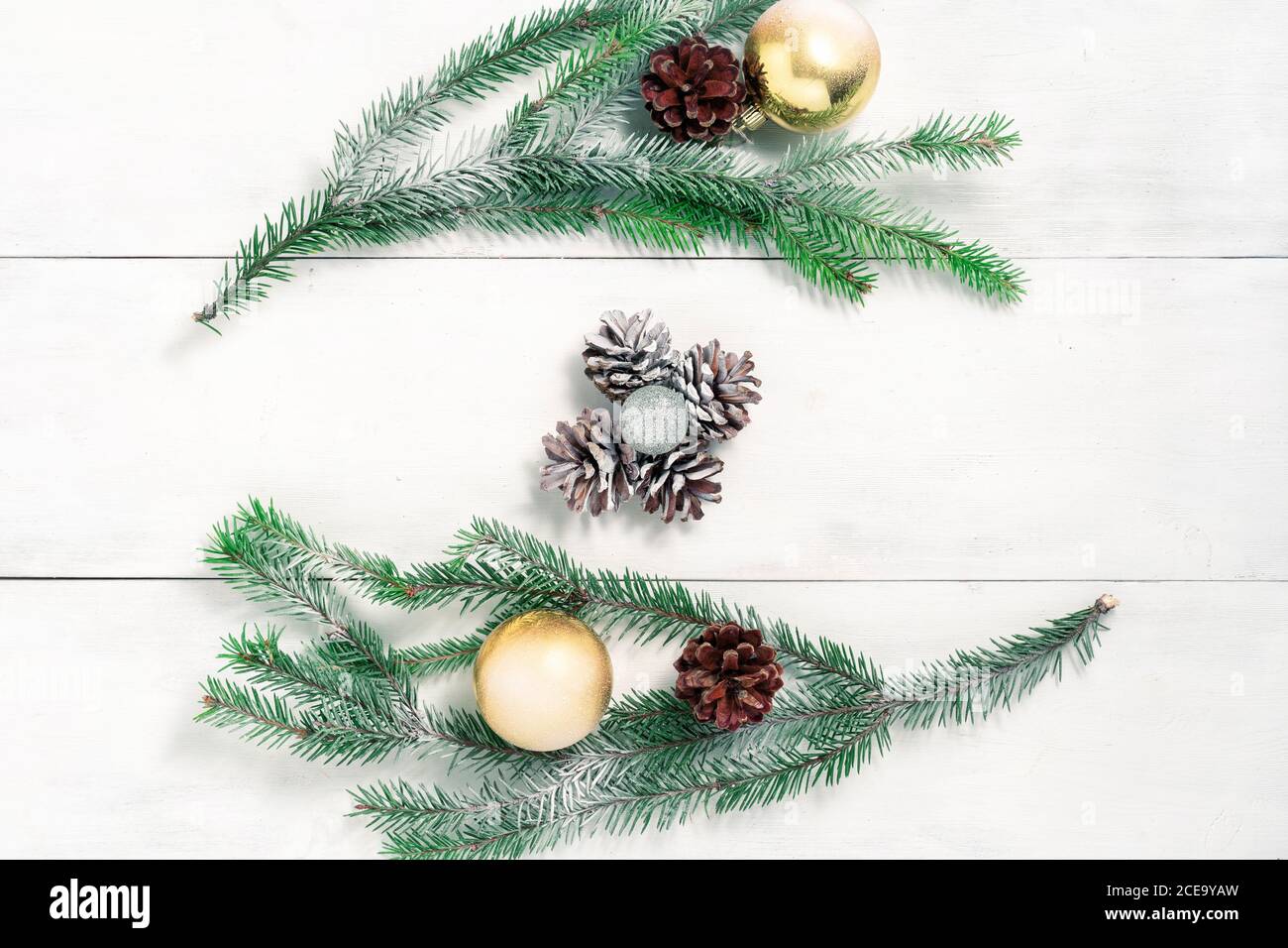 Christmas background with fir branches and pine cones covered with snow ...