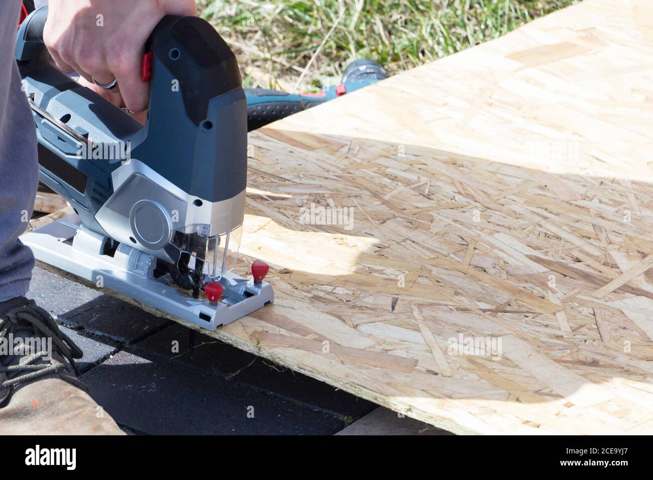 Young apprentice using circular saw
