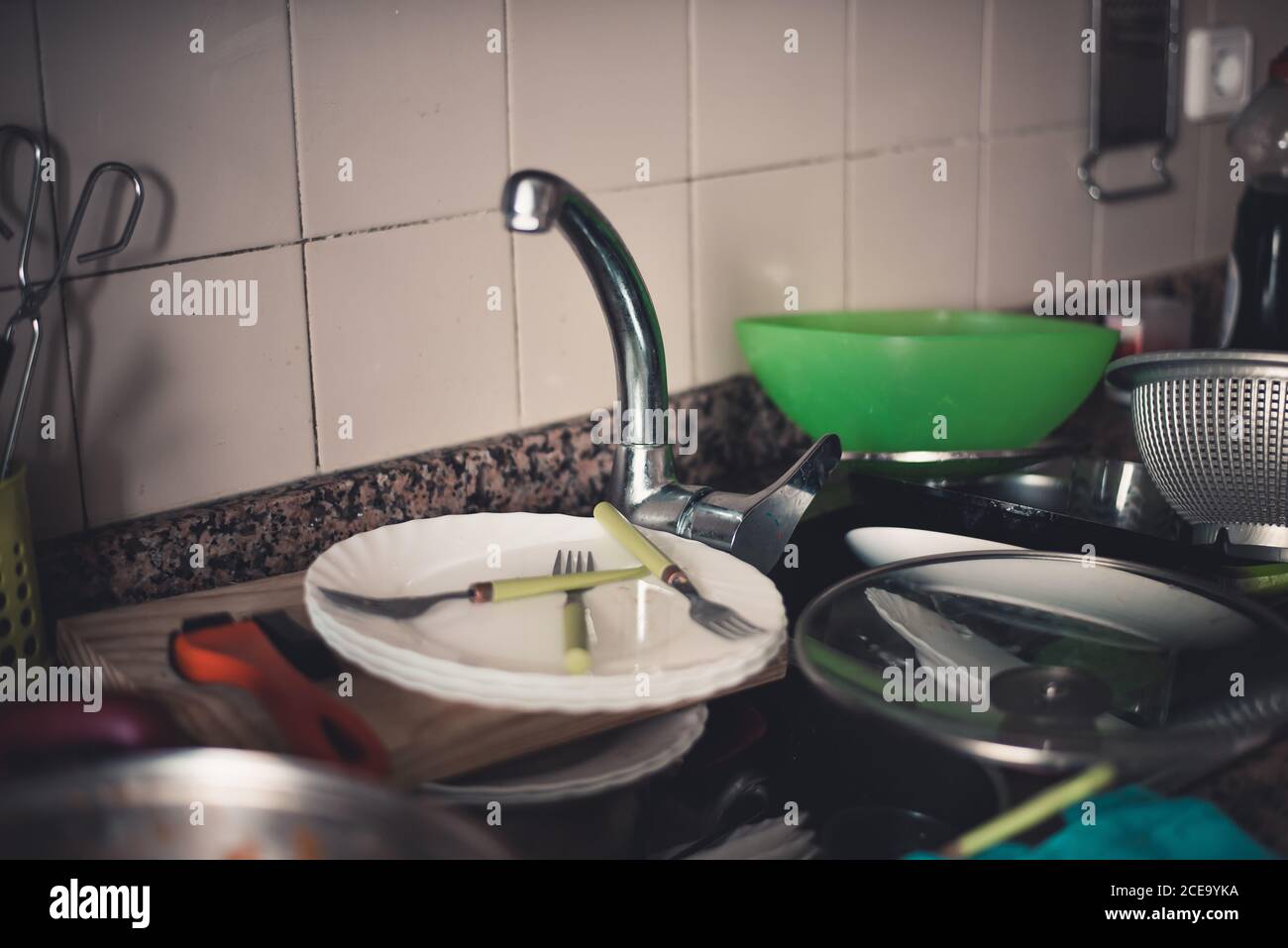 Faucet and dirty dishes Stock Photo