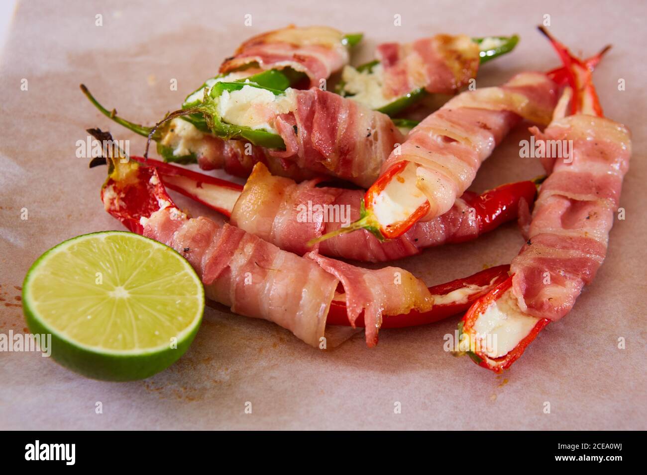 Jalapeno poppers wrapped in bacon stuffed with cheese seasoned with