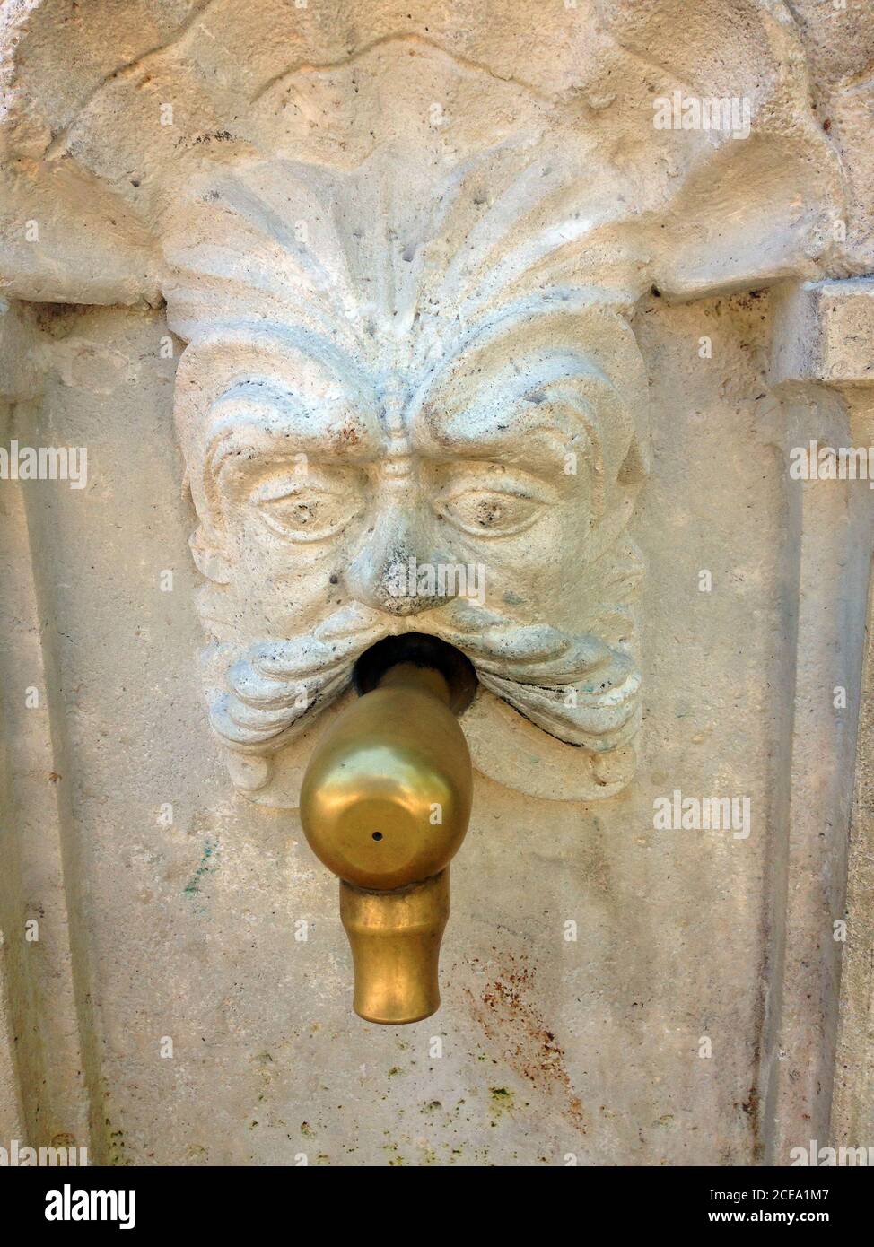 Stone Carved Face Fountain Stock Photo