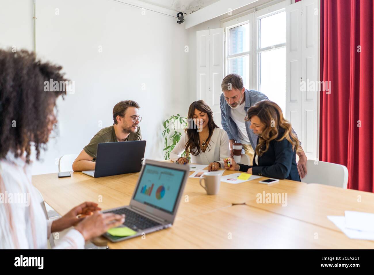 Colleagues discussing graphs Stock Photo