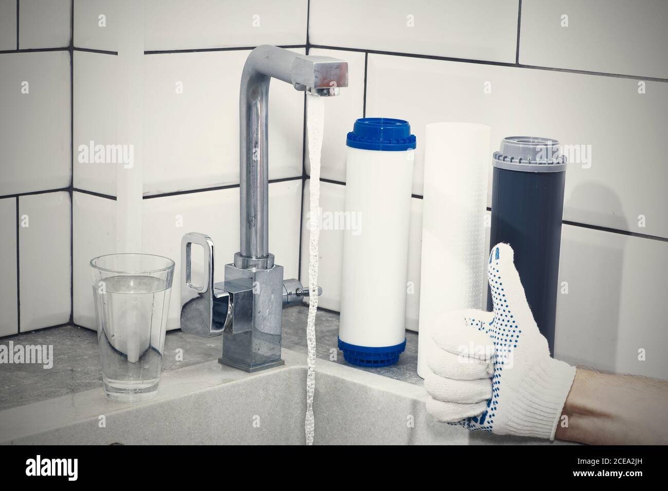 Replacement of filters in the water purification system. Closeup view