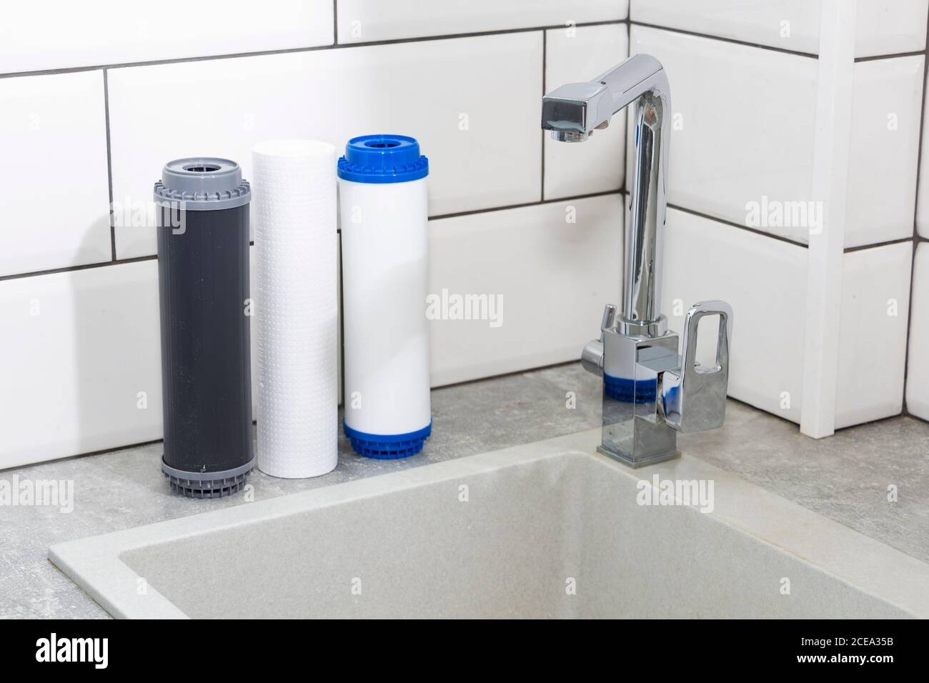 Replacing the water filter. Ecology. Clean water Stock Photo Alamy