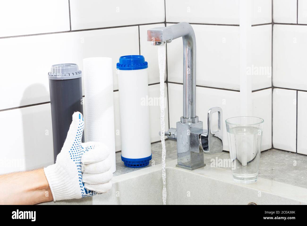 Replacement of filters in the water purification system. Closeup view
