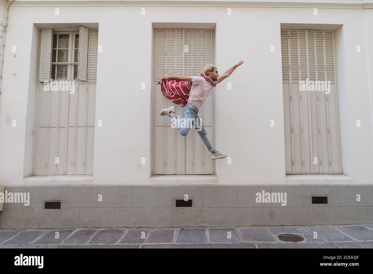 man jumping on street Stock Photo