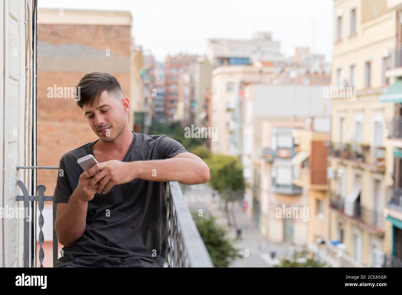 man using phone outdoors Stock Photo