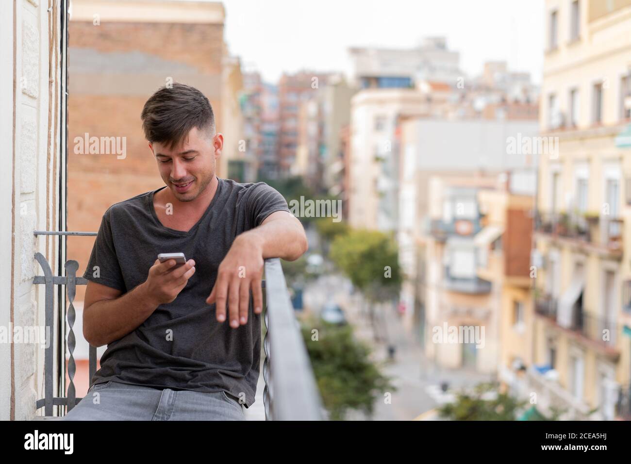 man using phone outdoors Stock Photo