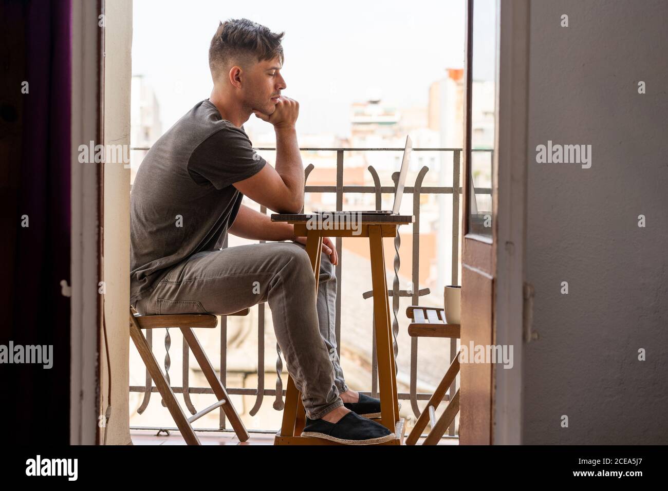 man using laptop outdoors Stock Photo