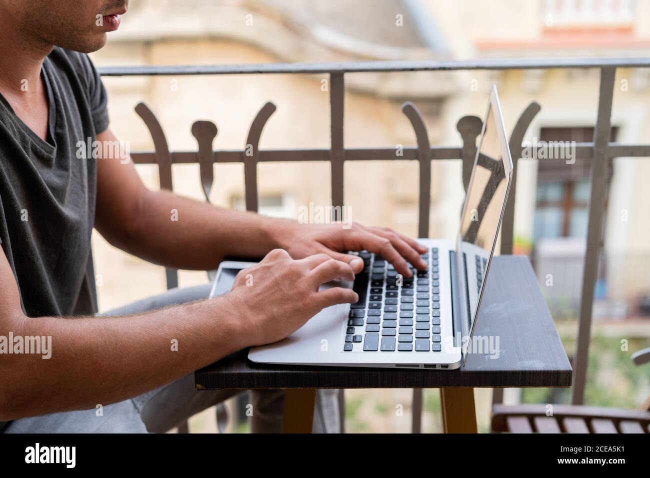 man using laptop outdoors Stock Photo