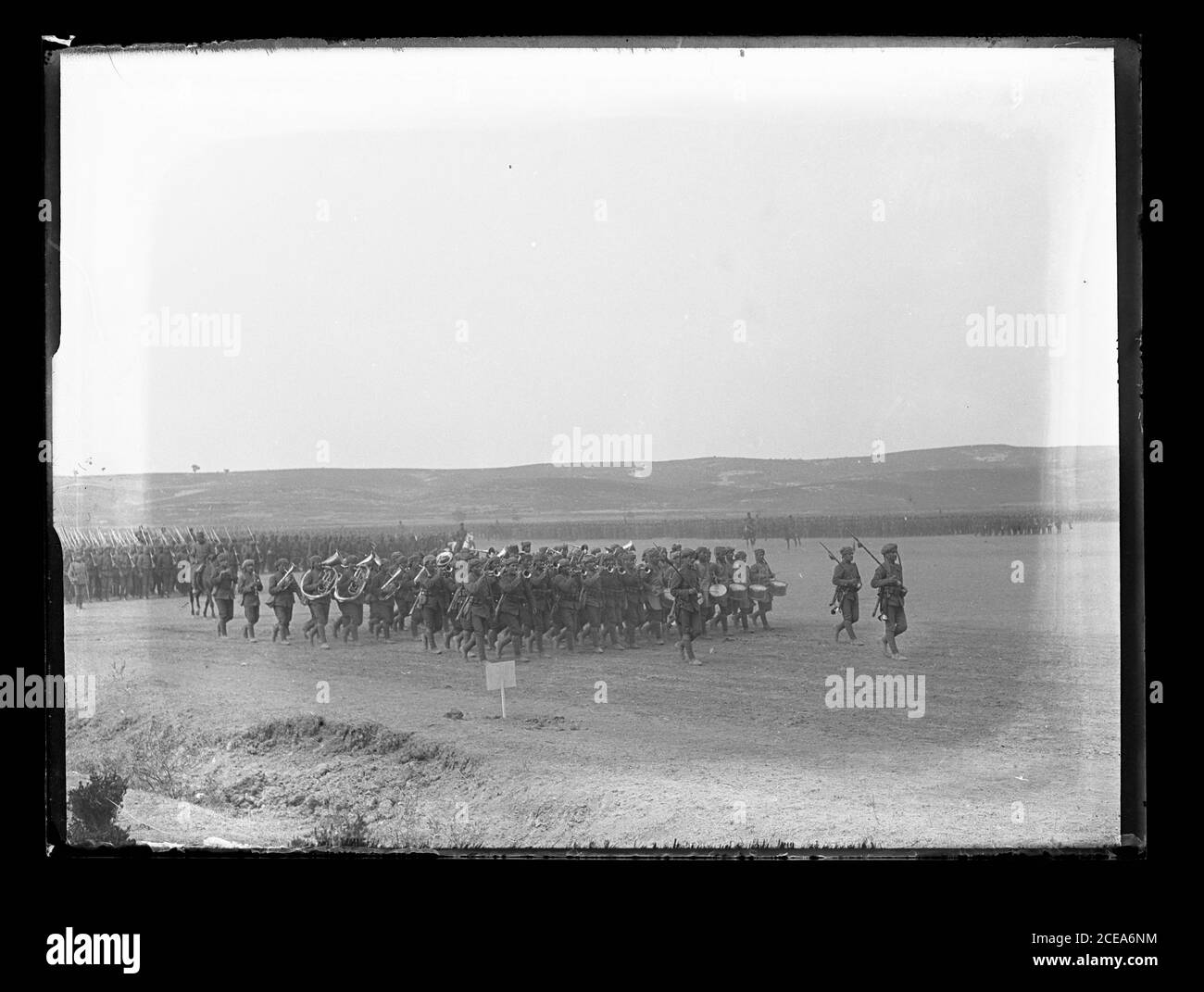 Ottoman Turkish pre-WW I infantry music formation parading on a field.  The soldiers wear headwraps and puttees. Photograph on dry glass plate from the Herry W. Schaefer collection, around 1913. Stock Photo