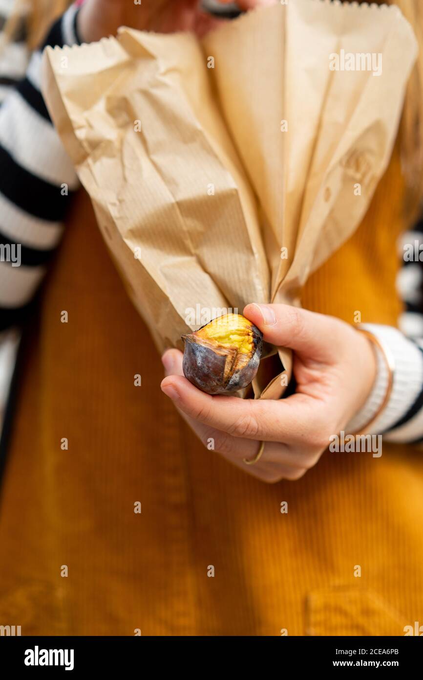 Woman in casual wear holding paper packets Stock Photo