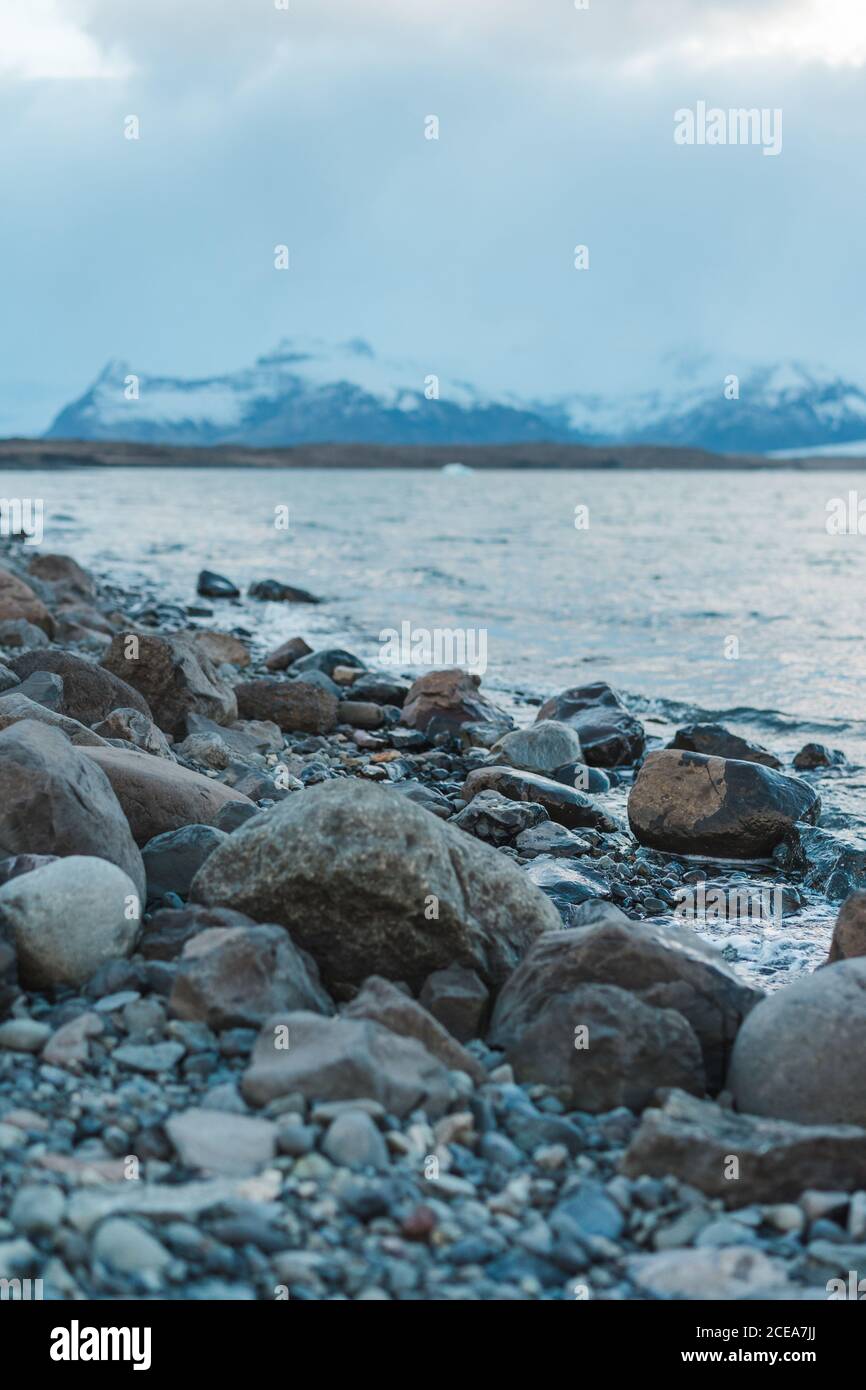 Spectacular mountain lake with stony shore in Skaftafell, Iceland and Vatnajokull Stock Photo