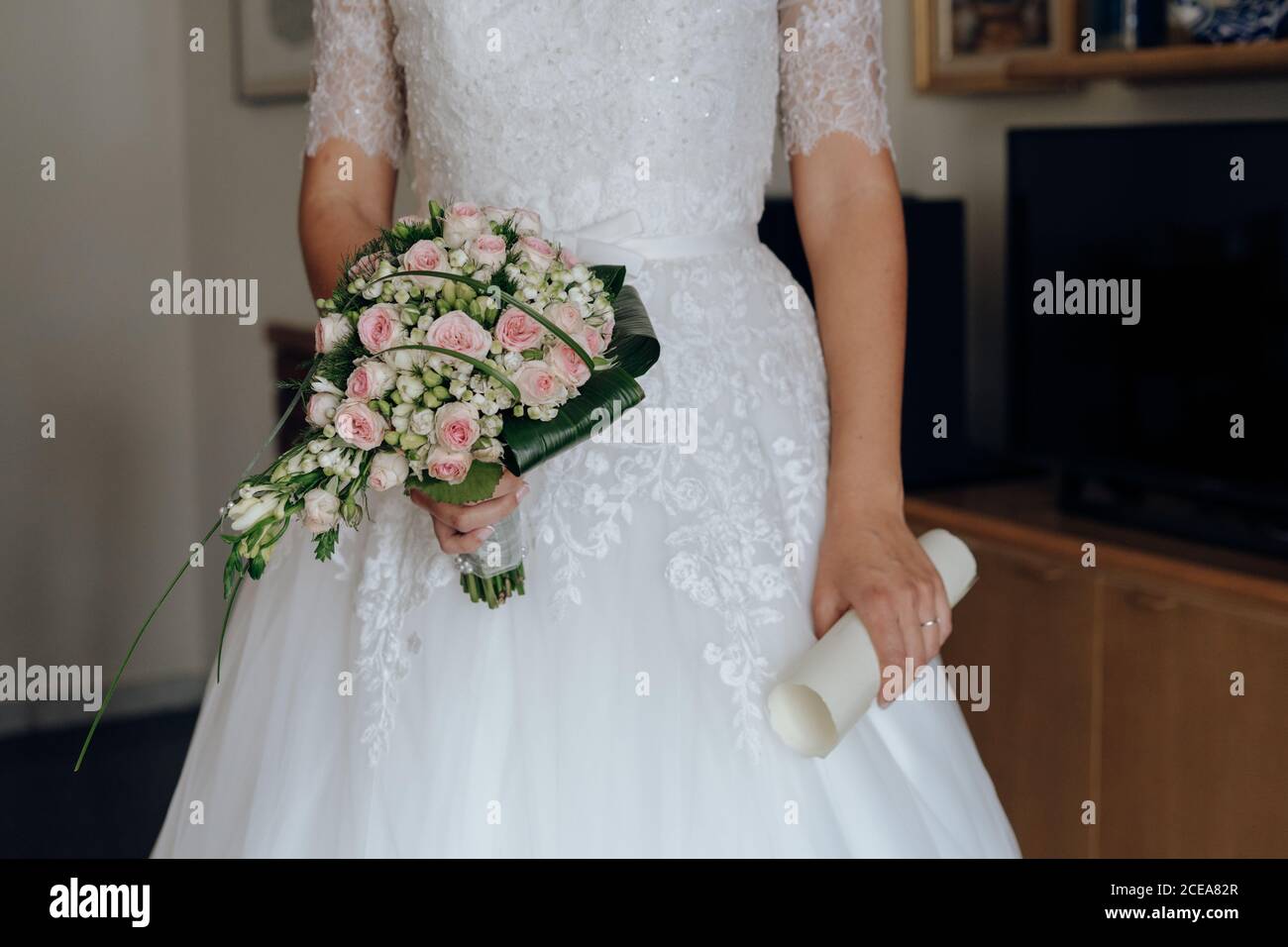 faceless bride with rose bouquet Stock Photo