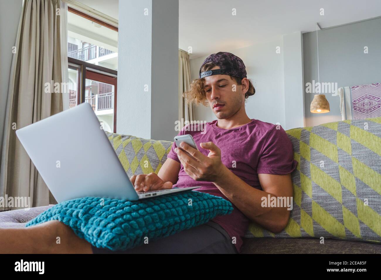 man resting and using laptop Stock Photo