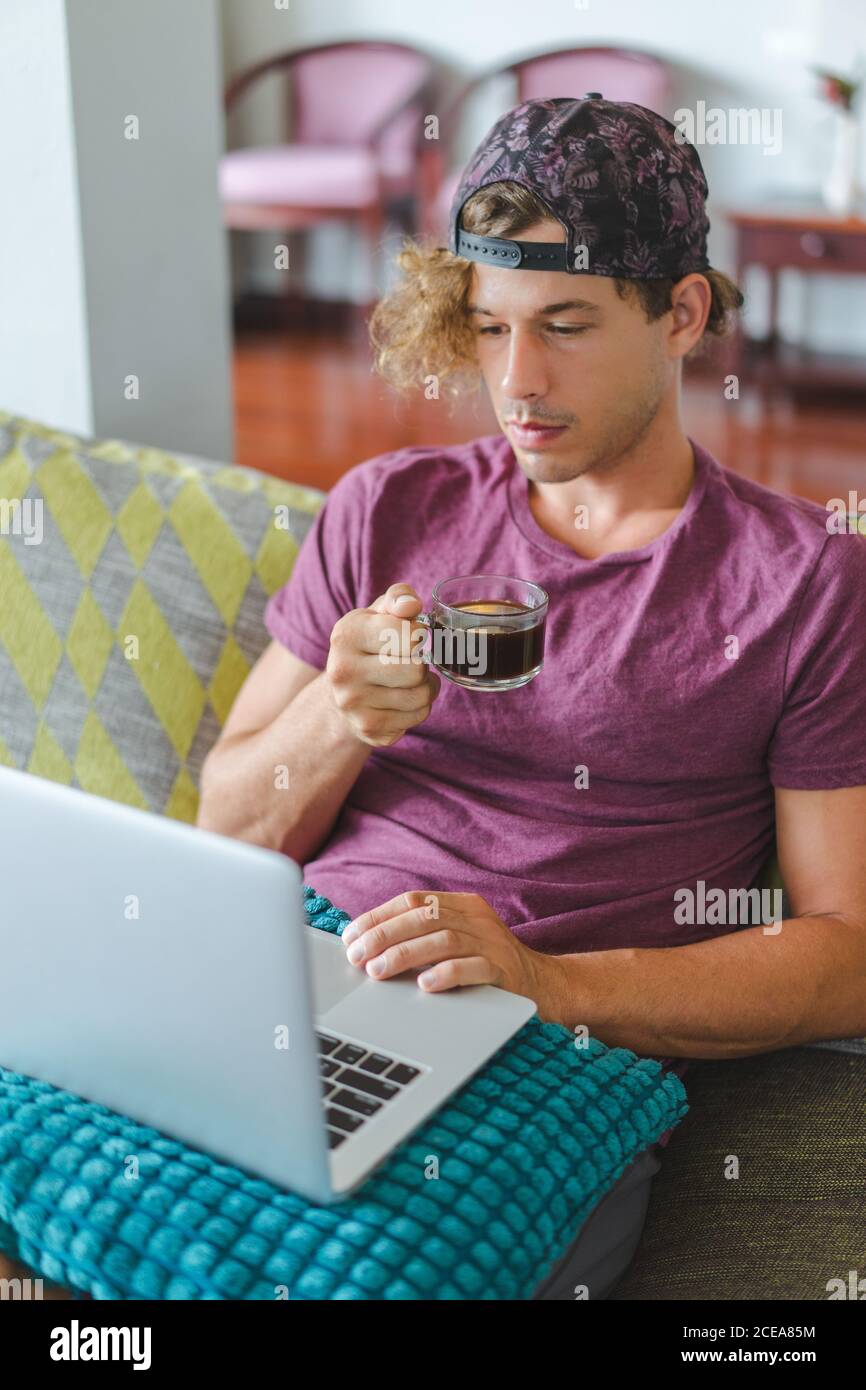 man resting and using laptop Stock Photo