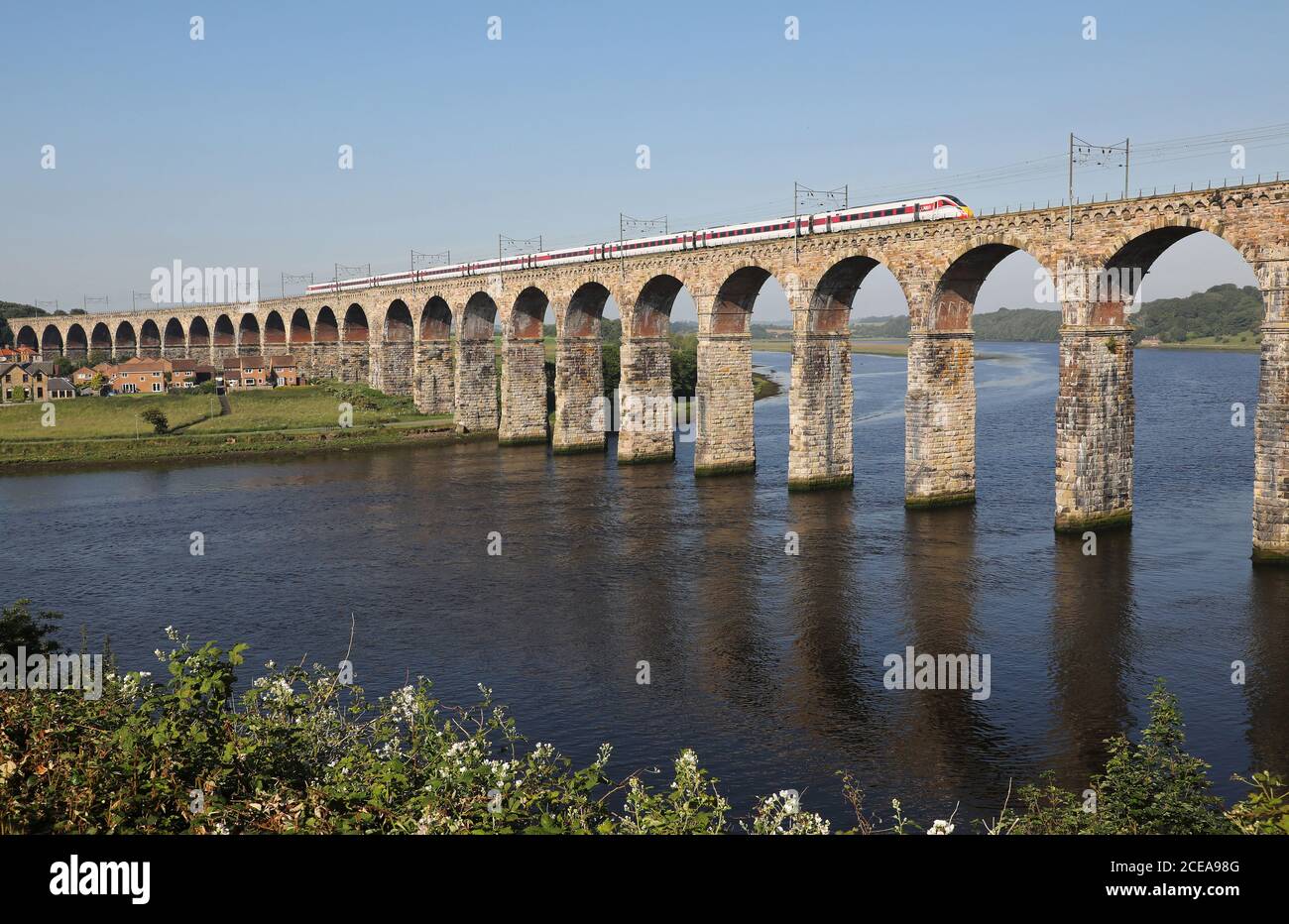 A LNER Azuma heads over the Royal Border Bridge at Berwick upon Tweed. Stock Photo