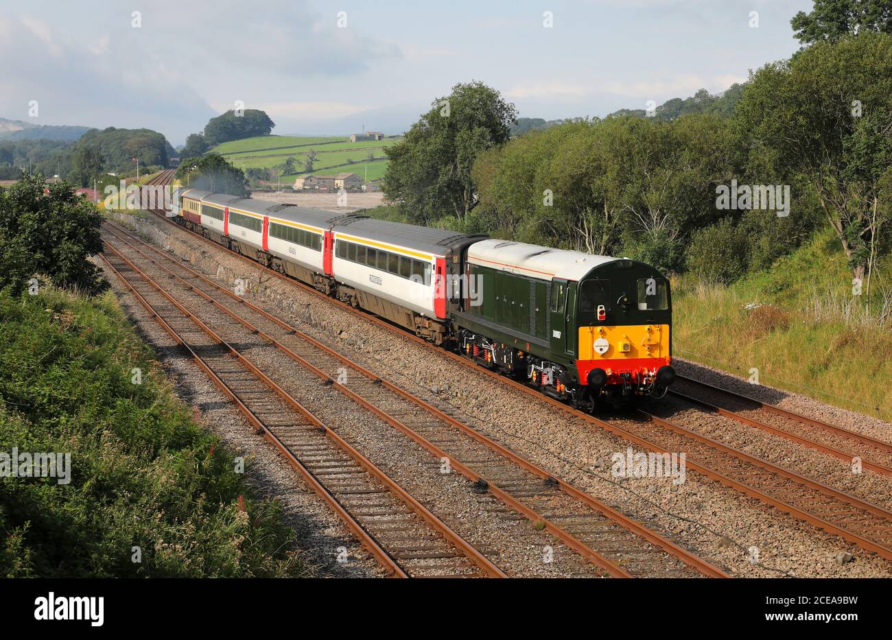 D8107/20107 passes Settle Jc with a Rail Charter services train.t Stock Photo