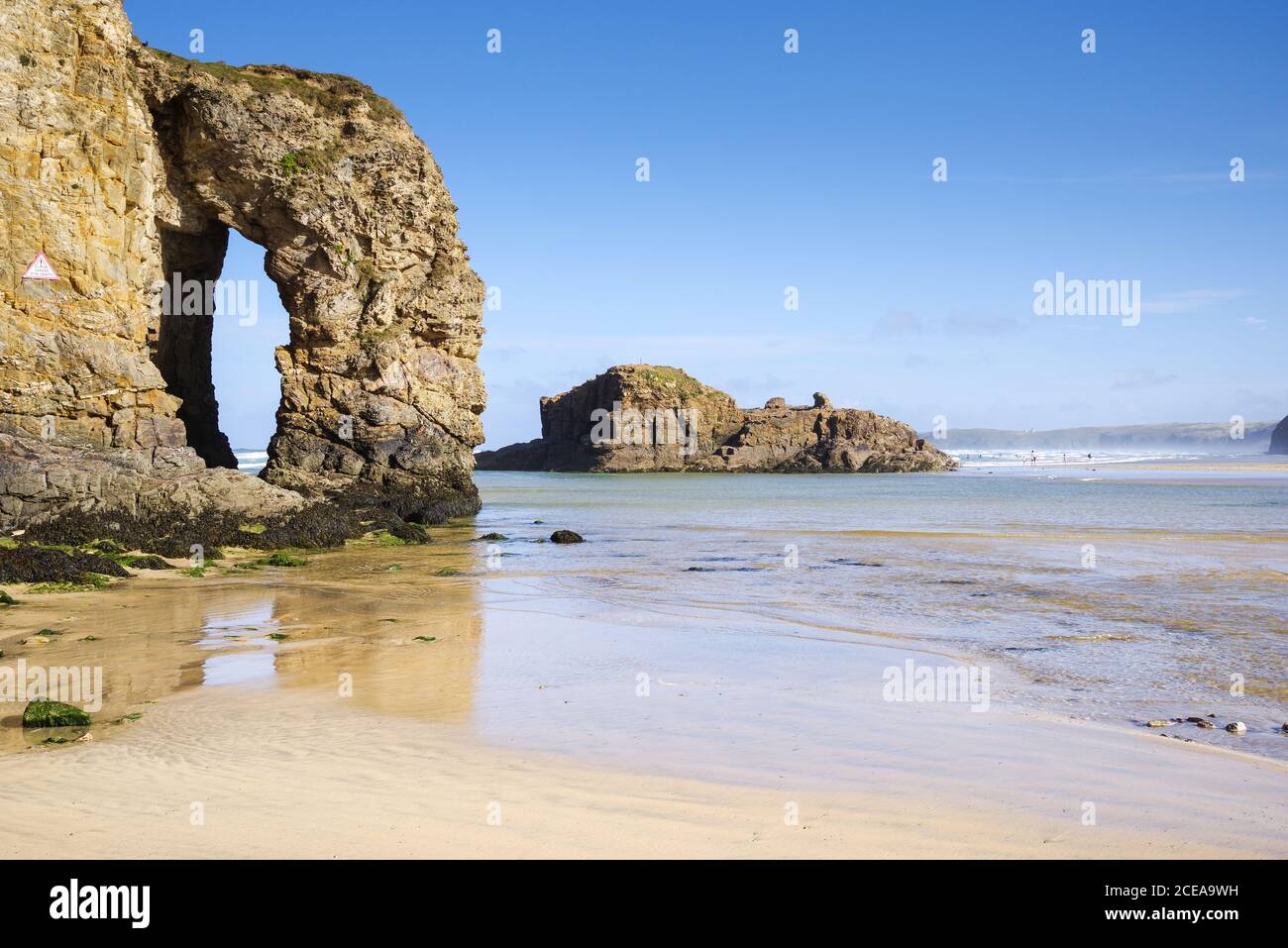 Spectacular Perrantport Arch Rock - a hole in the cliff caused by erosion (Cornwall, UK) Stock Photo