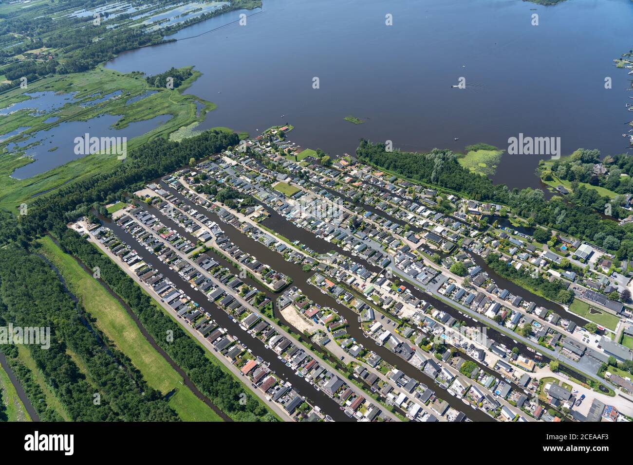 The Netherlands from above with green fields, rivers and houses on the water Stock Photo