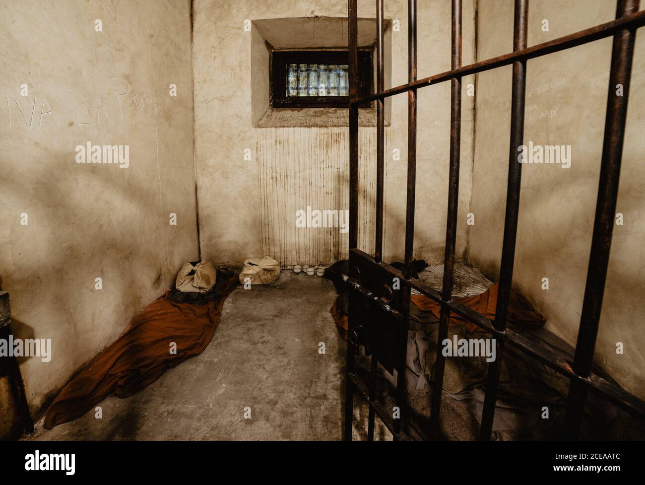 Grungy concrete wall inside prison cell in Oviedo, Spain Stock Photo