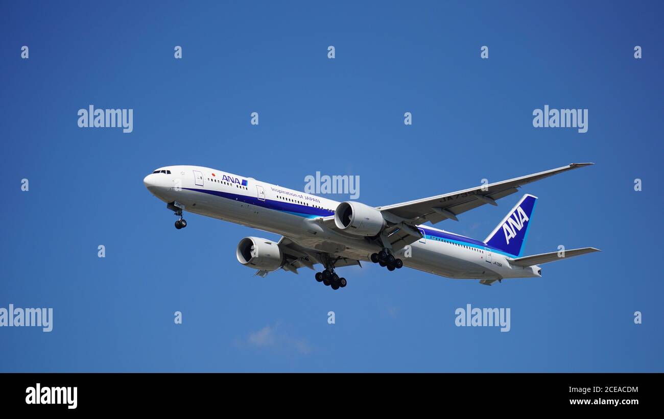 ANA Boeing 777-381 prepares for landing at Chicago O'Hare International Airport. The plane's registration is JA735A. Stock Photo