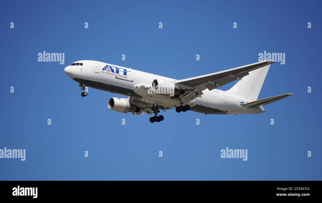ATI (Air Transport International) Boeing 767 cargo plane prepares to land at Chicago O'Hare International Airport. Stock Photo