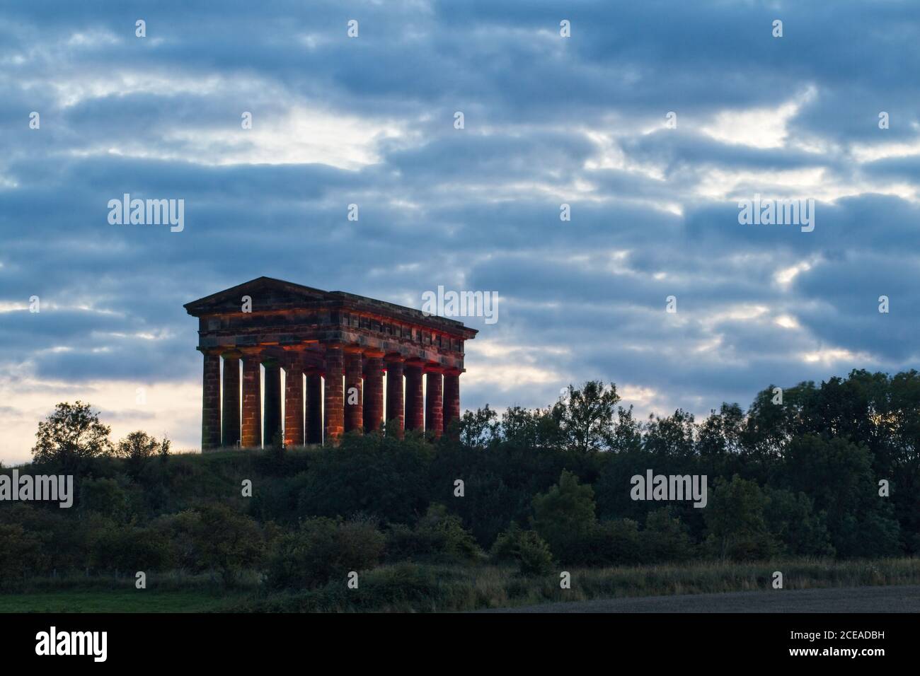 The landmark Earl of Durham Monument stands on a hilltop near Penshaw in County Durham. Image captured at dusk. Stock Photo