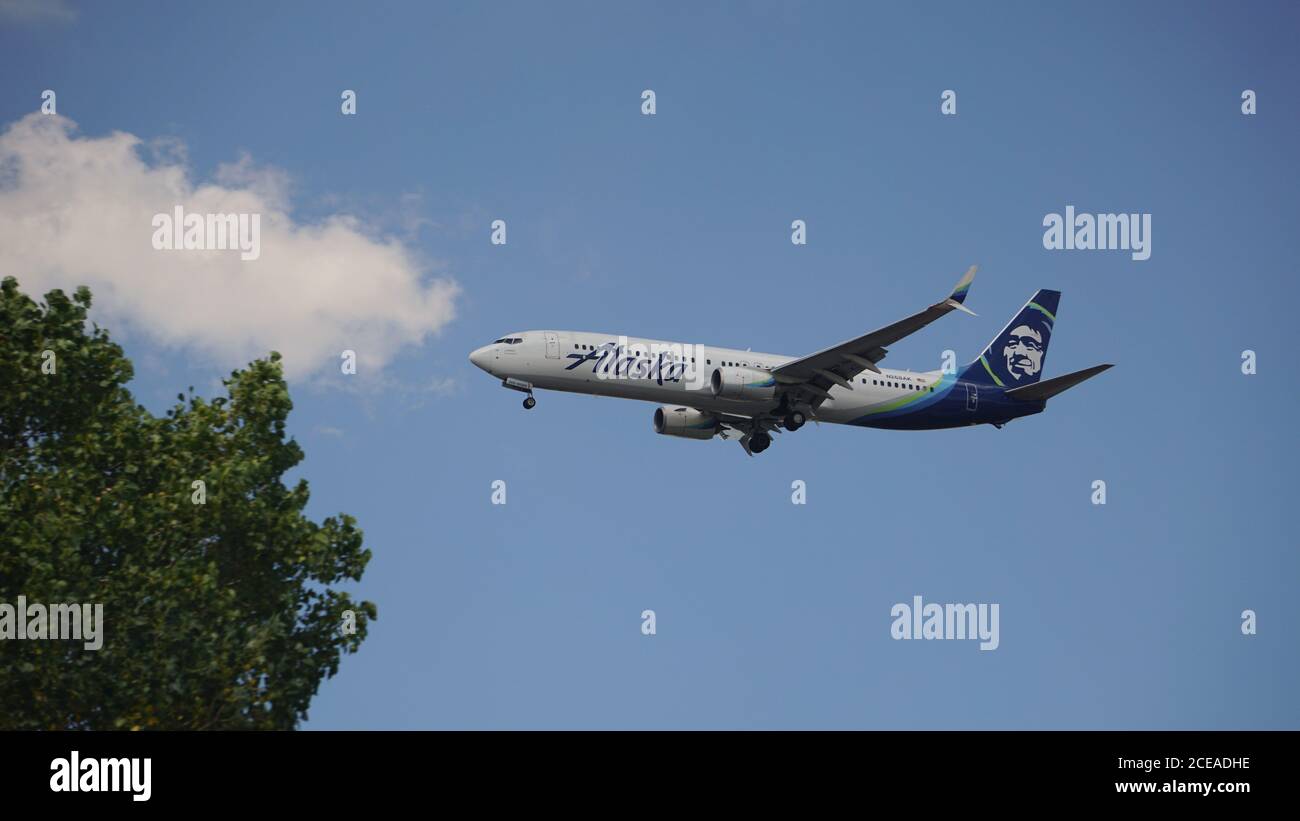Alaska Airlines Boeing 737-900 prepares for landing at Chicago O'Hare International Airport. The plane's registration is N268AK. Stock Photo