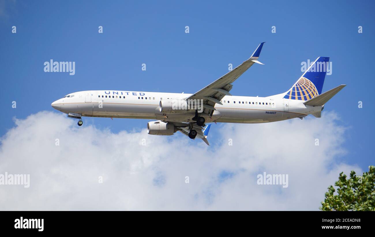 United Airlines Boeing 737-924 prepares to land at Chicago O'Hare International Airport. The plane's registration number is N66837. Stock Photo