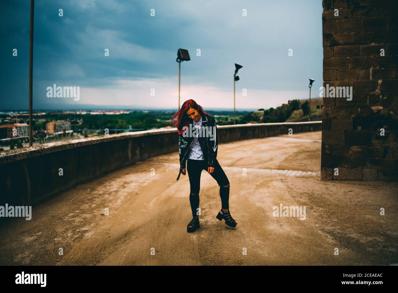 Confident millennial girl on cityscape Stock Photo