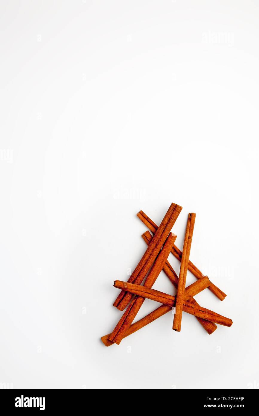 Cinnamon sticks arranged on a white background Stock Photo