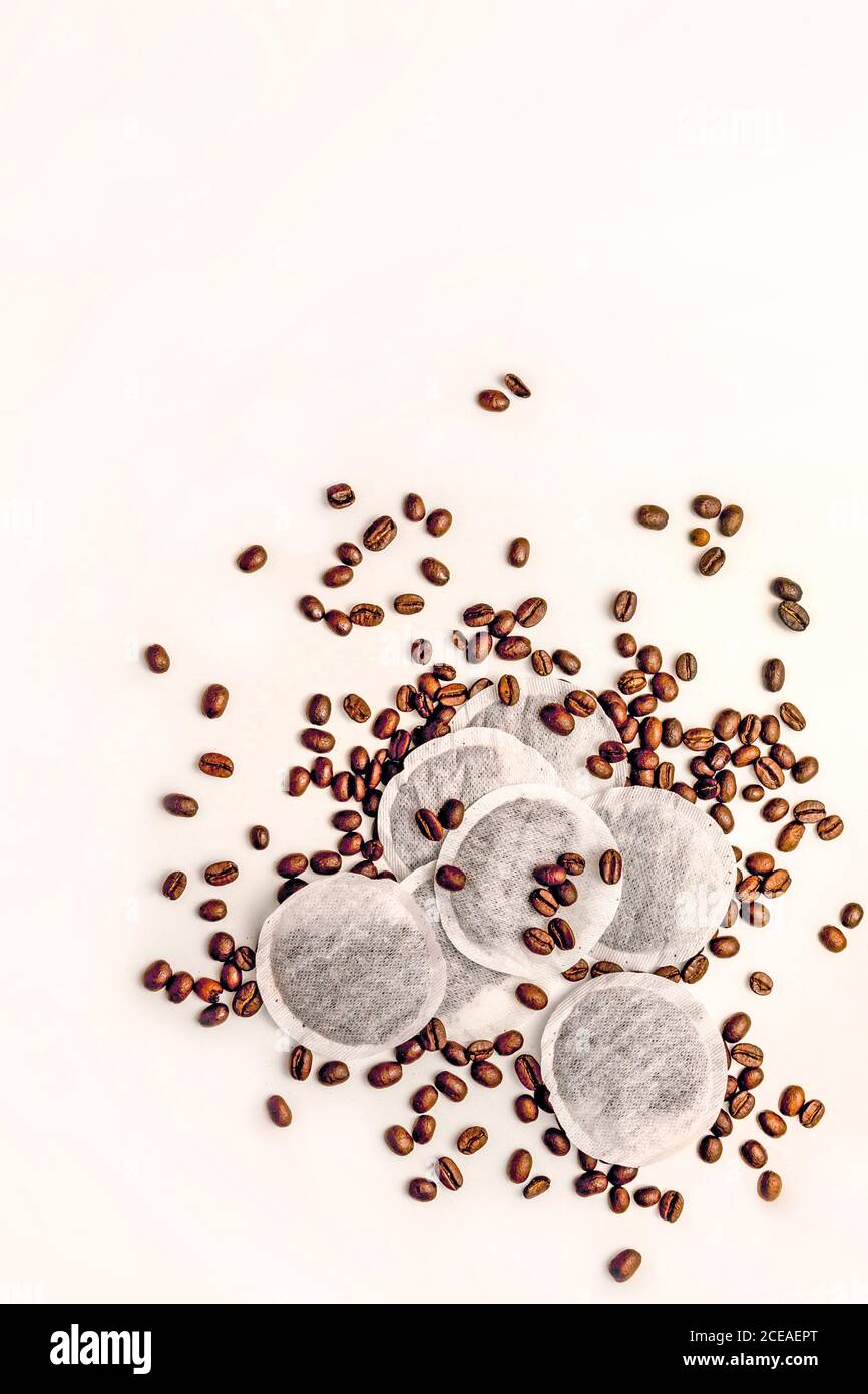 Coffee beans and tea bags on a white background Stock Photo
