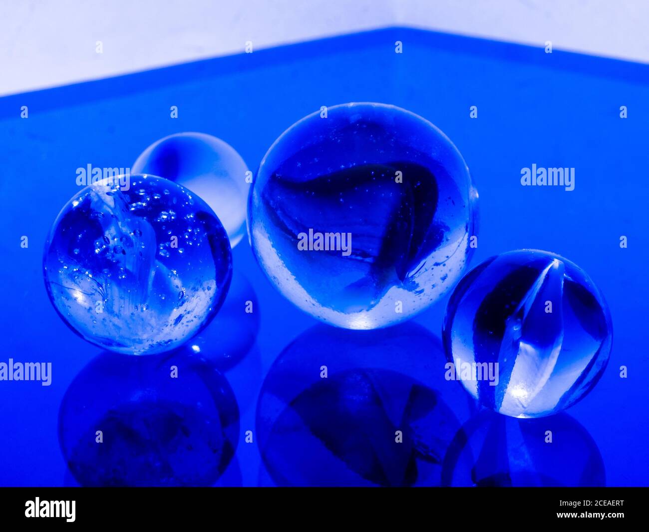 Purey Glass marbles. Child's play Stock Photo - Alamy
