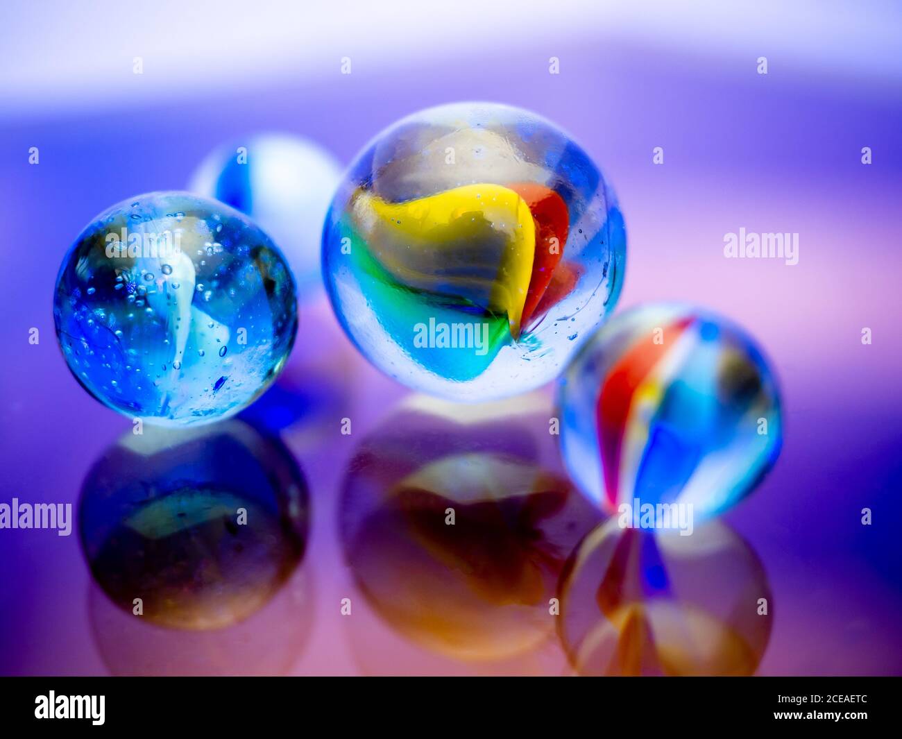Purey Glass marbles. Child's play Stock Photo - Alamy