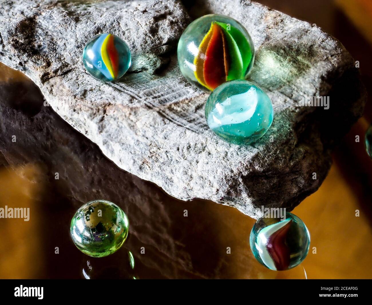 Purey Glass marbles. Child's play Stock Photo - Alamy
