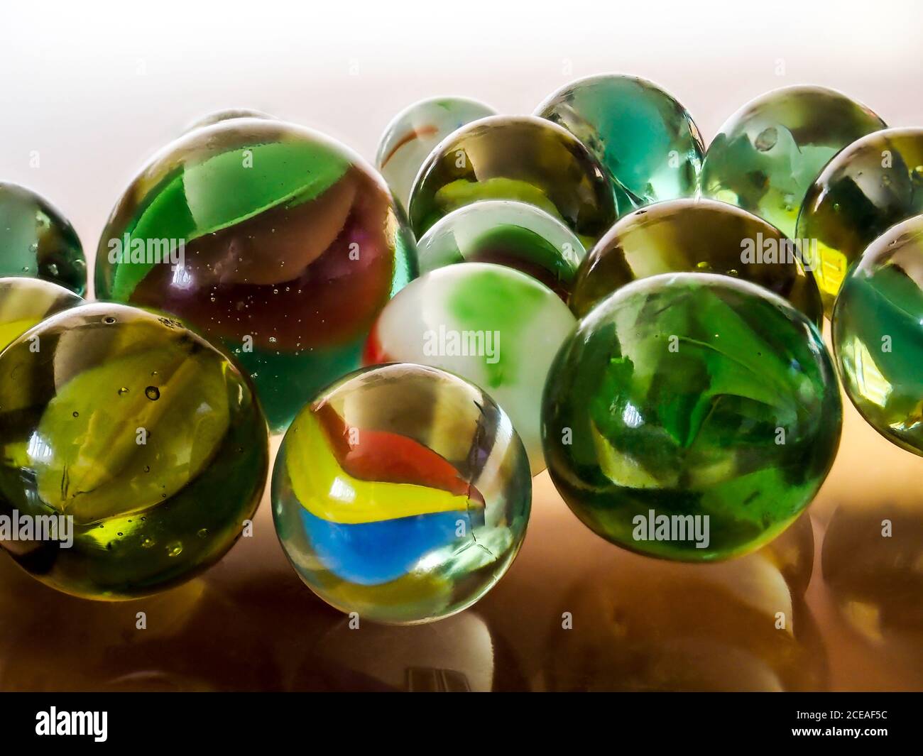 Purey Glass marbles. Child's play Stock Photo - Alamy