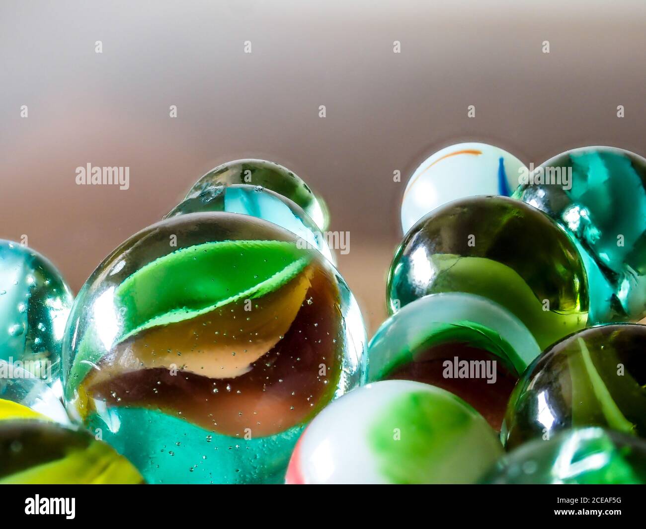 Purey Glass marbles. Child's play Stock Photo - Alamy