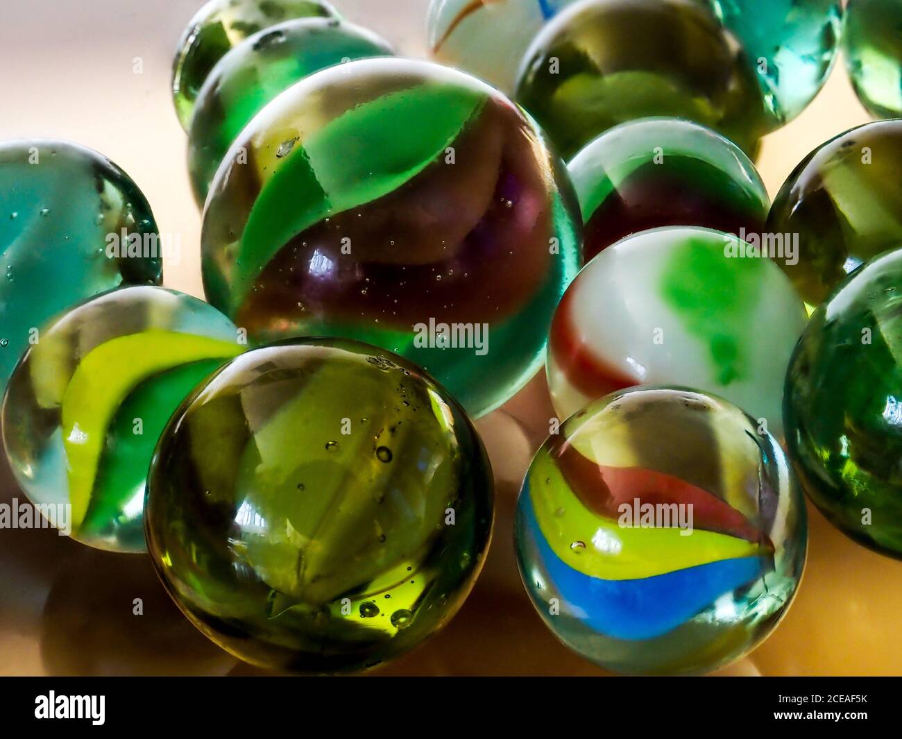 Purey Glass marbles. Child's play Stock Photo - Alamy