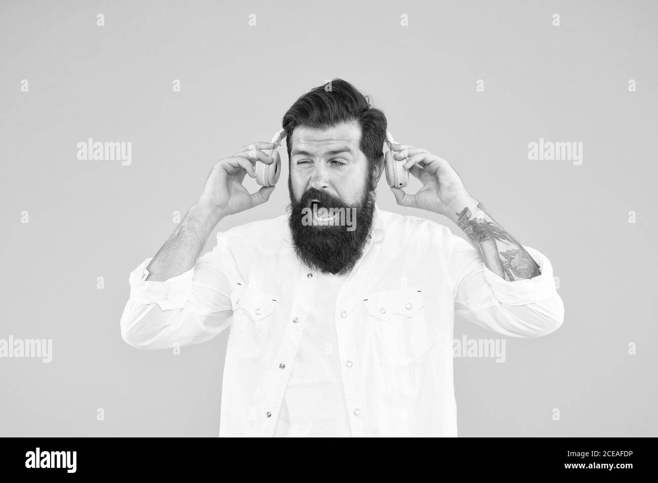 Hearing problem. Bearded man headphones. Active Noise Cancellation