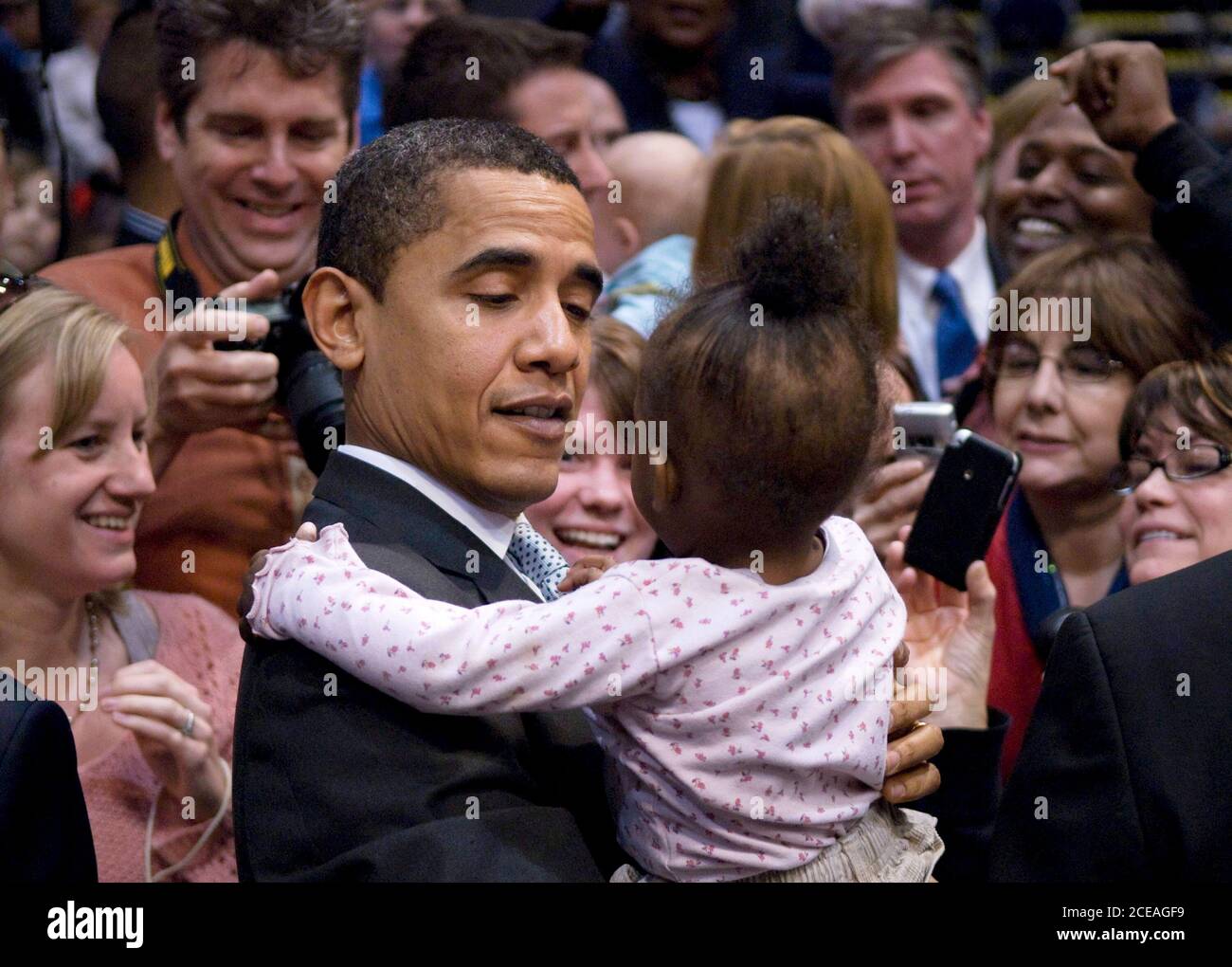 Austin, TX February 28, 2008: Democratic presidential candidate Barack Obama holds a small girl after speaking at an Austin 'town-hall' style event on his economic proposals at the Austin Convention Center. The presidential candidates are descending on Texas in advance of the state's primary next Tuesday. ©Bob Daemmrich Stock Photo