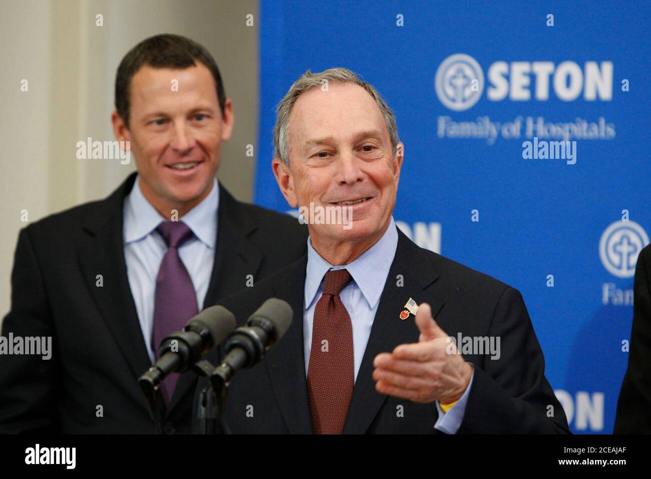 Austin, Texas USA, January 18, 2008: New York City Mayor Michael Bloomberg speaks to reporters about a new cancer health initiative as Lance Armstrong listens at Brackenridge Hospital after touring a cancer ward.  ©Bob Daemmrich Stock Photo